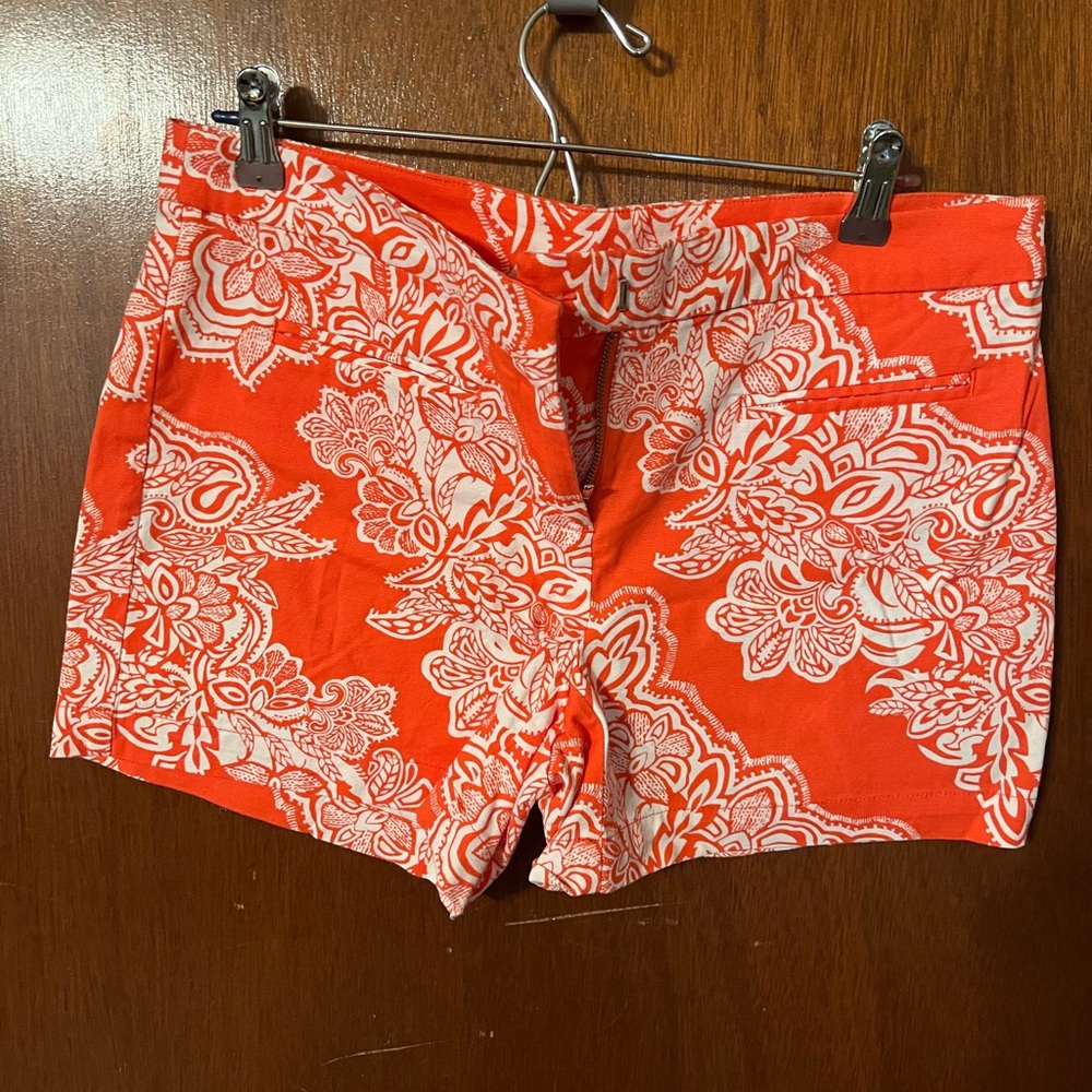 Bright coral/orange and white pattern shorts